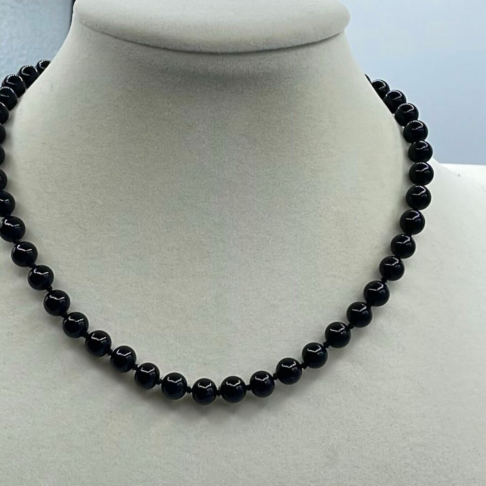 Vintage Monet black glass beaded necklace knotted. Logo tag.